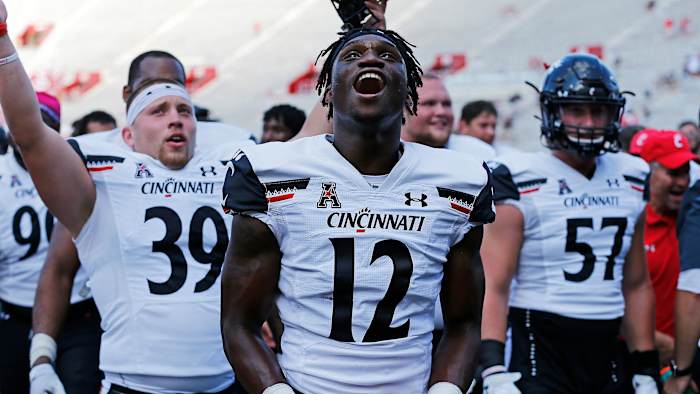 Cincinnati Bearcats players celebrate the win at Indiana